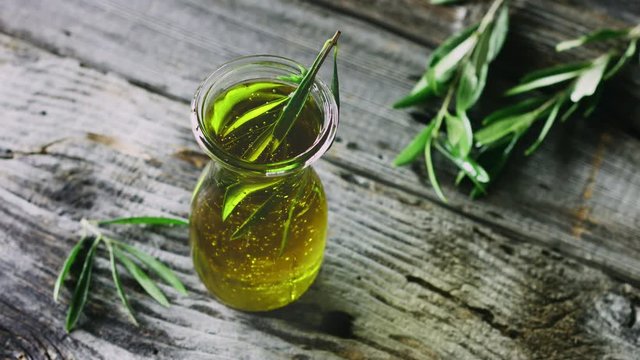 Olive oil with olive twig