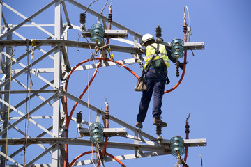 electric tower of  high voltage Is disassembled by specialists  worker