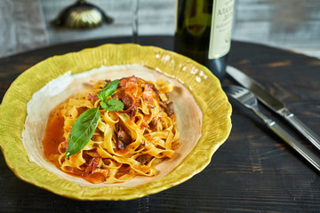 Italian penne pasta with tomatoes and pesto in a restaurant jpg