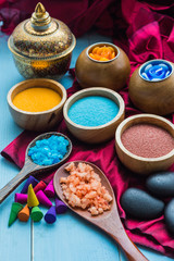 spa and massge items lay on blue wooden background