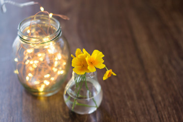 Summer flowers in a glass bulb with a bokeh.