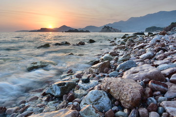 Sunset at the beach. Crvena Glavica. Budva riviera. Montenegro