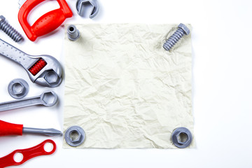 Kids toys frame background. toy tools, construction  on white background. Top view. Flat lay. Copy space for text