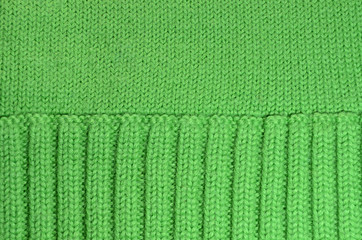Texture of green woolen knitted background