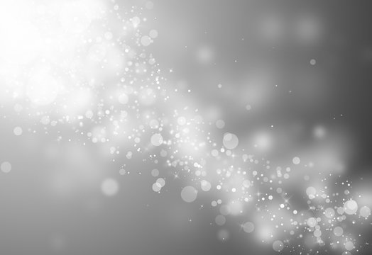 Gray glitter sparkles rays lights bokeh Festive Christmas Elegant abstract background.