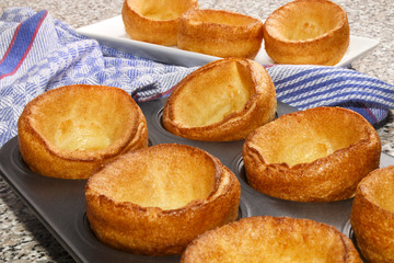 freshly baked yorkshire pudding in a baking tray