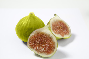 Green figs on a white background.