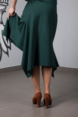 Details of women's clothing: green skirt on the model
