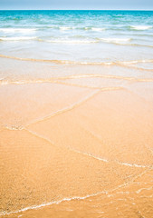 Fototapeta na wymiar Light reflection on the surface of sea on sand beach