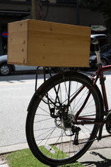 Fototapeta na wymiar Bicycle parked closeup wheel rack wooden box