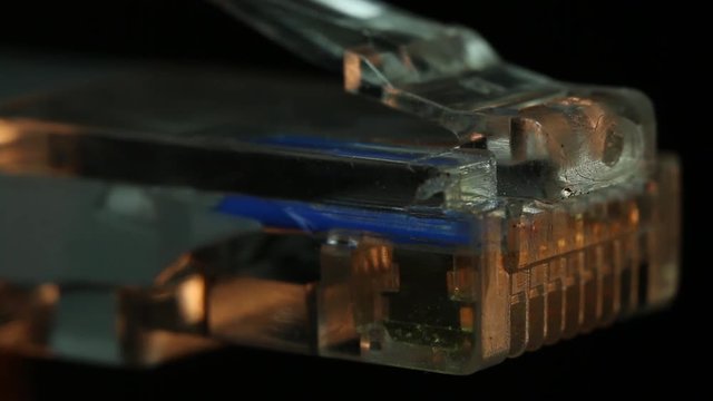 Extreme close up, ethernet plug melts under heat