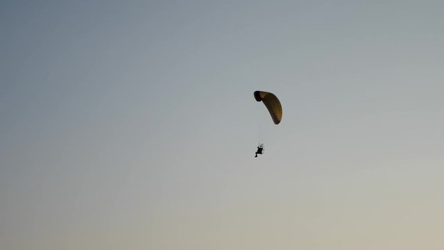 Following Parachute silhouette. Slow motion