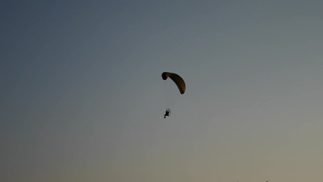 Following Parachute silhouette. Slow motion