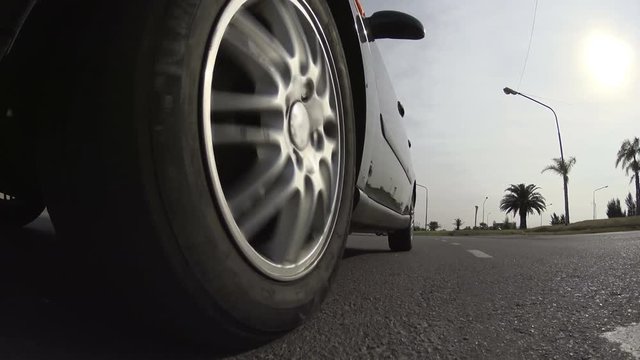 Driving a car. Wheel spinning POV - Point of View, day country side, neighborhood, city, sunset, fall / winter. Trees on the side. Fast Speed / time-lapse. 