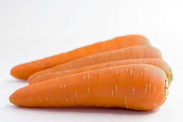 Fresh carrots isolated on white background.