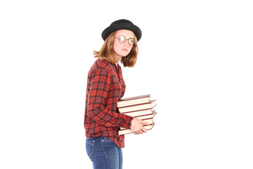 Portrait of female teenage student in hat holding stack of books