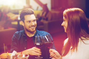 couple dining and drinking wine at restaurant
