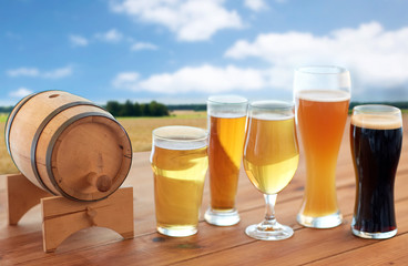 different types of beer in glasses on table