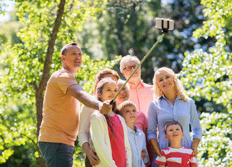 Fototapeta premium happy family taking selfie in summer garden