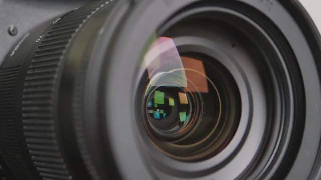 Close up of the camera lens with diaphragm camera shutter blade and sound. 