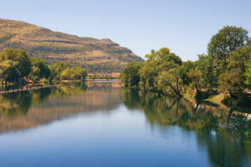 Fototapeta na wymiar View of Trebisnjica river near Trebinje town on a summer day. Bosnia and Herzegovina, Republika Srpska