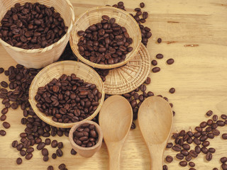 coffee bean in little basket and spoon wood on slat wood
