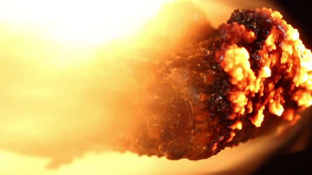 Macro close up, ethernet plug ignites in flames
