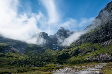 Fototapeta na wymiar Scenic view from mountain peak at bright summer day in Lofoten, Norway