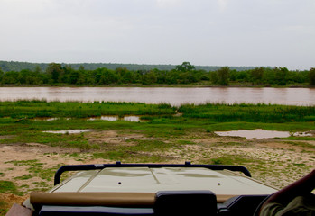Landscape shot of a river at the Selous Game Reserve in Tanzania (Africa) from within a safari jeep/car