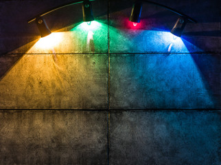 Background image of a dark wall with a lamp