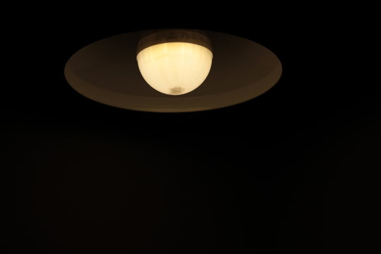 yellow spot and lamb in the dark room