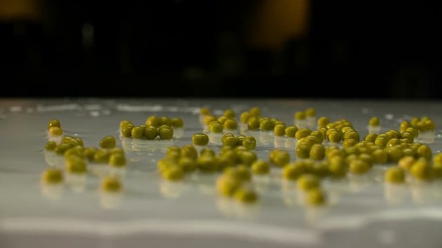 Flls pease over wet table. super slow