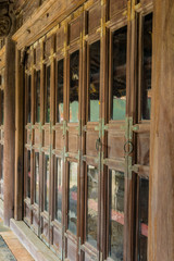 The corridor with the wood windows at Tu Duc tomb in Hue Vietnam