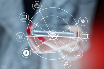 Girl hand holding phone surrounded with media icons