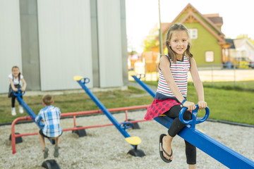Fototapeta na wymiar cheerful school age child play on playground school