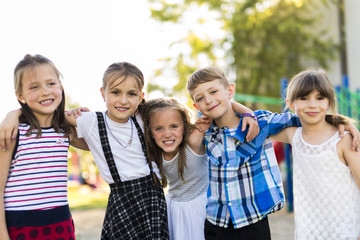 cheerful school age child play on playground school