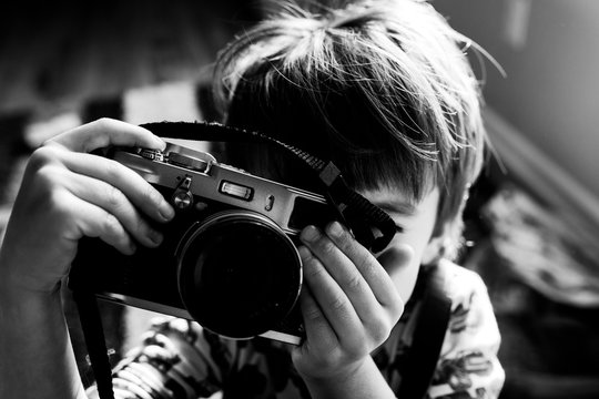 child taking a photo