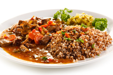 Roasted meat, groats and vegetables