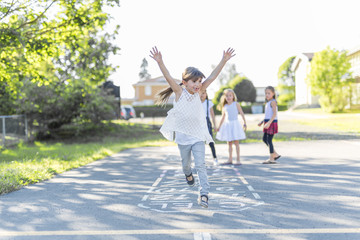 Obraz premium cheerful school age child play on playground school