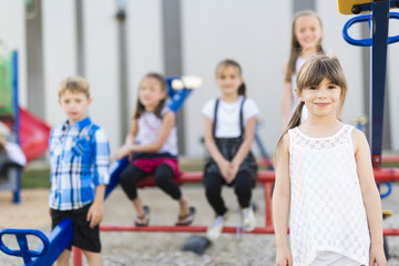 Obraz premium cheerful school age child play on playground school