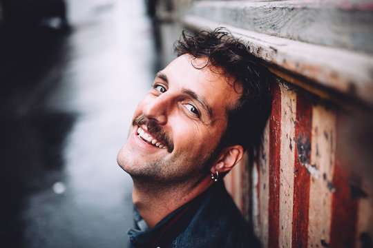 Man with moustache smiling
