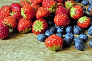 Blueberries and strawberries on a table