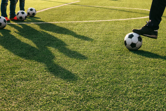 Man kicking football