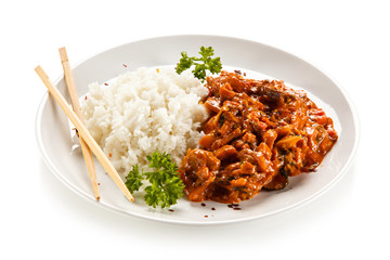 Rice dish with sauce on white background