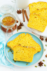 Homemade pumpkin bread with seeds and orange peel.