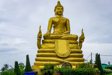 Big golden buddha statue sitting