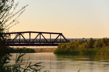 Fototapeta na wymiar Lepsi river banks with railroad bridge, Kazakhstan, Taldykorgan