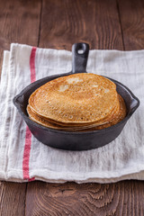 A stack of pancakes with sour cream and honey for Maslenitsa