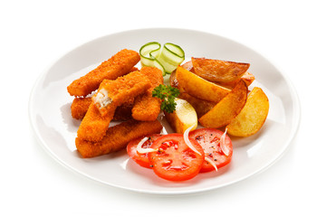 Fried fish fingers, potatoes and vegetables