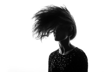 portrait of a girl with developing hair on a white background
